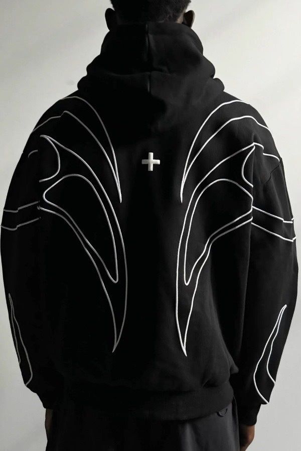 Full length zip and ribbed hem on a black embroidered hoodie