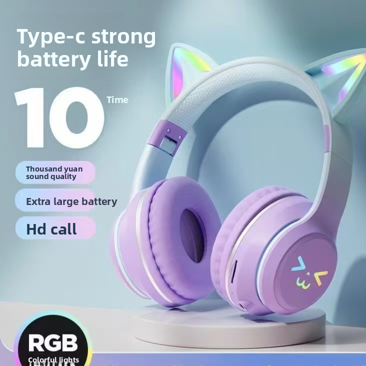 Purple gradient cat ear headphones on a plinth showing the padded ear cushions