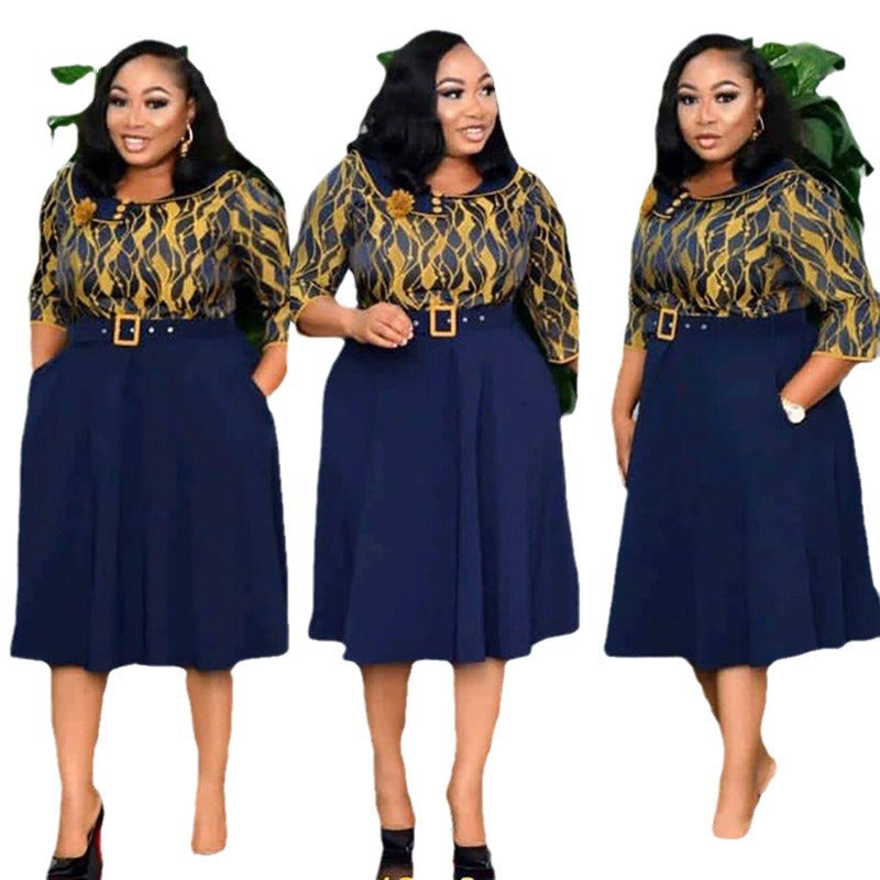 Navy belted midi dress with printed bodice and pleated swing skirt shown from three angles