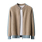 Camel wool zip cardigan with light blue sleeves and hem band over a white tee on a white background