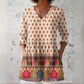 Loose printed tunic with three quarter sleeves with the peplum skimming the waist and hip