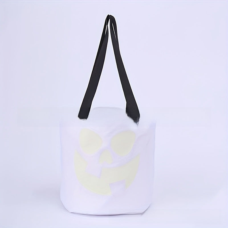 Canvas Halloween candy bucket shown with its glow in the dark jack o lantern face