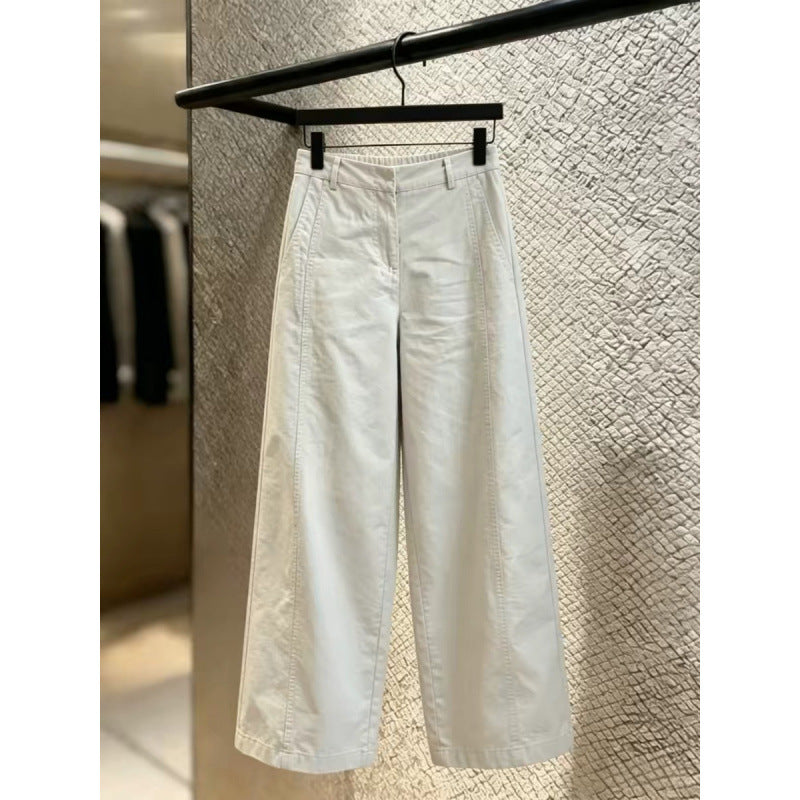 Ecru wide leg trousers full length view with the pressed front seam