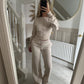 Womens two piece lounge set, a front zip jacket and straight leg drawstring pants in a soft sweat knit