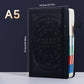 Black A5 zodiac embossed planner notebook standing with elastic band and colored page edges