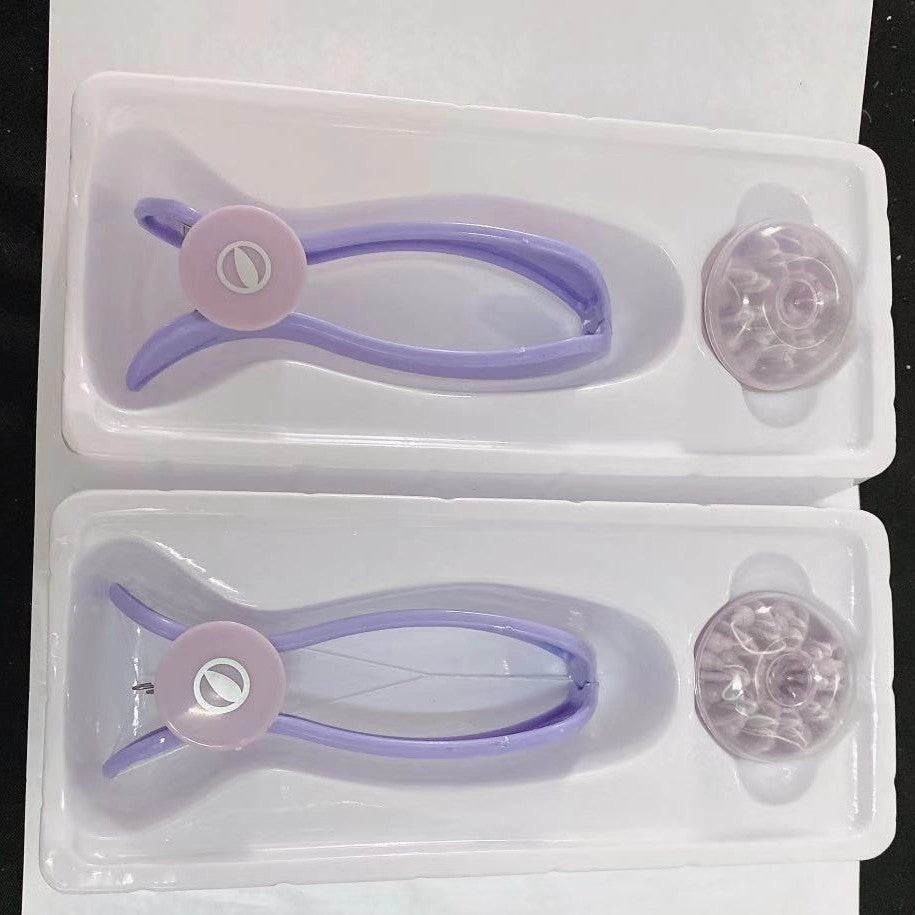 Two lilac cotton thread facial hair removers in trays with their round holders beside them