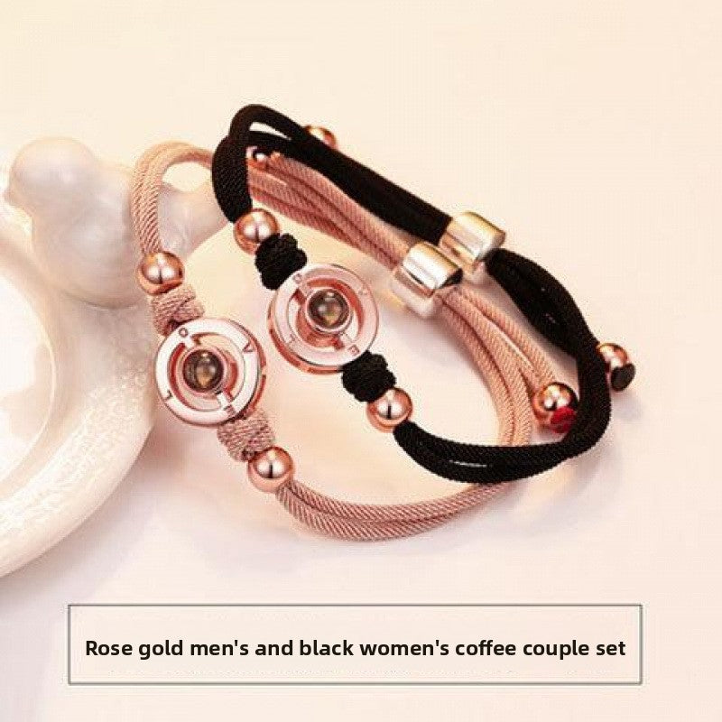Detail close on the metal accent finish of the couple bracelets cord band