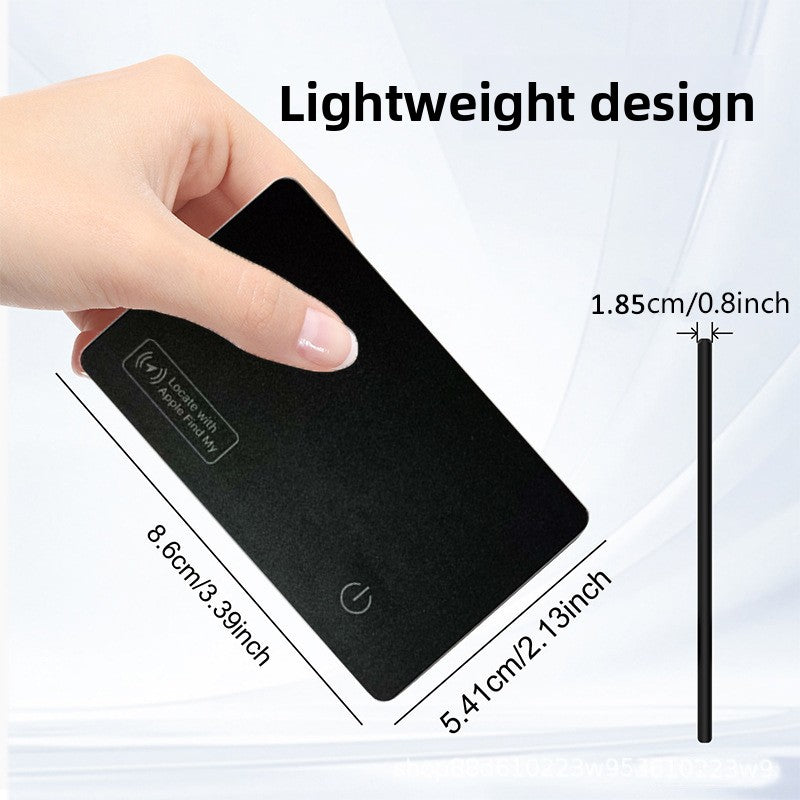 Black card tracker resting on its round wireless charging base