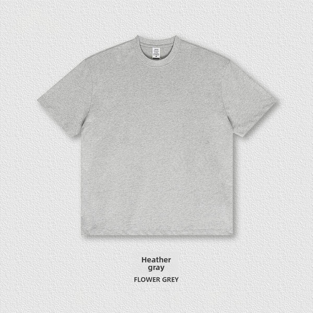 Flat lay of the heavyweight 305g cotton crew neck tee showing the boxy oversized cut and ribbed collar