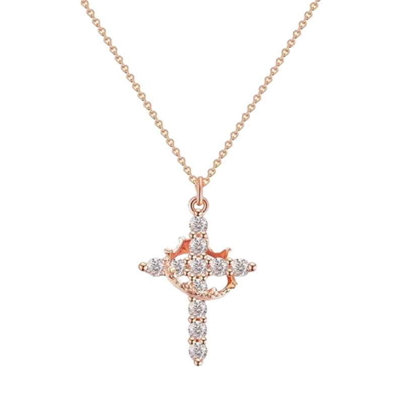 Zircon cross pendant necklace worn against an open neckline