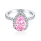 Front view of a pear cut pink stone halo ring on an S925 sterling silver pave band, rhodium white finish