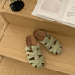 Woven slide sandals pair shown together in a color group