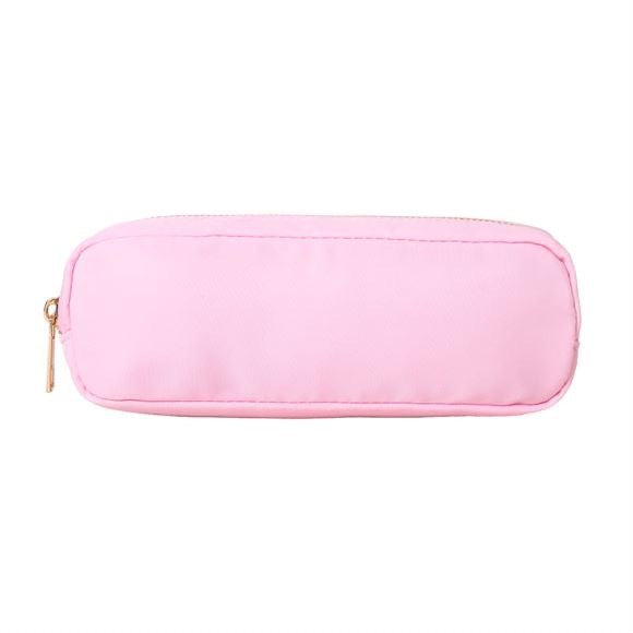 Primary school student using the nylon pencil case at a desk for homework