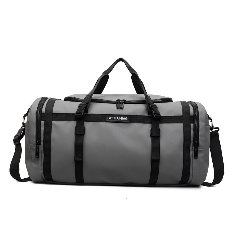 Beige travel duffel bag folded flat to show how compactly it stores away