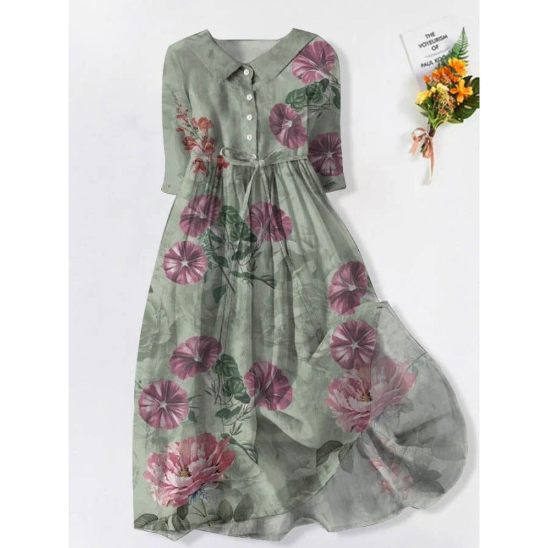 Womens doll collar floral print midi dress with a self tie waist shown on a hanger