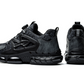 Pair of black steel toe work sneakers seen from the back