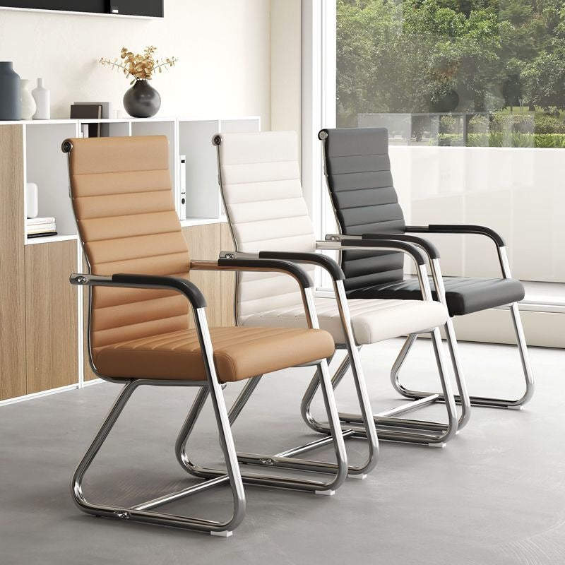 Three ribbed cantilever conference chairs in tan, ivory and black leather with fixed armrests in a bright office