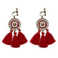 Bohemian tassel and bead clip-on drop earrings, aged tone zinc alloy frame, handmade pair on plain white background