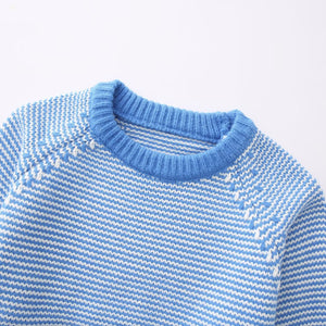 Striped knit women's sweater side angle showing relaxed fit and ribbed cuff detail