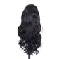 Back view of a long black synthetic wig with loose rolling waves on a white background