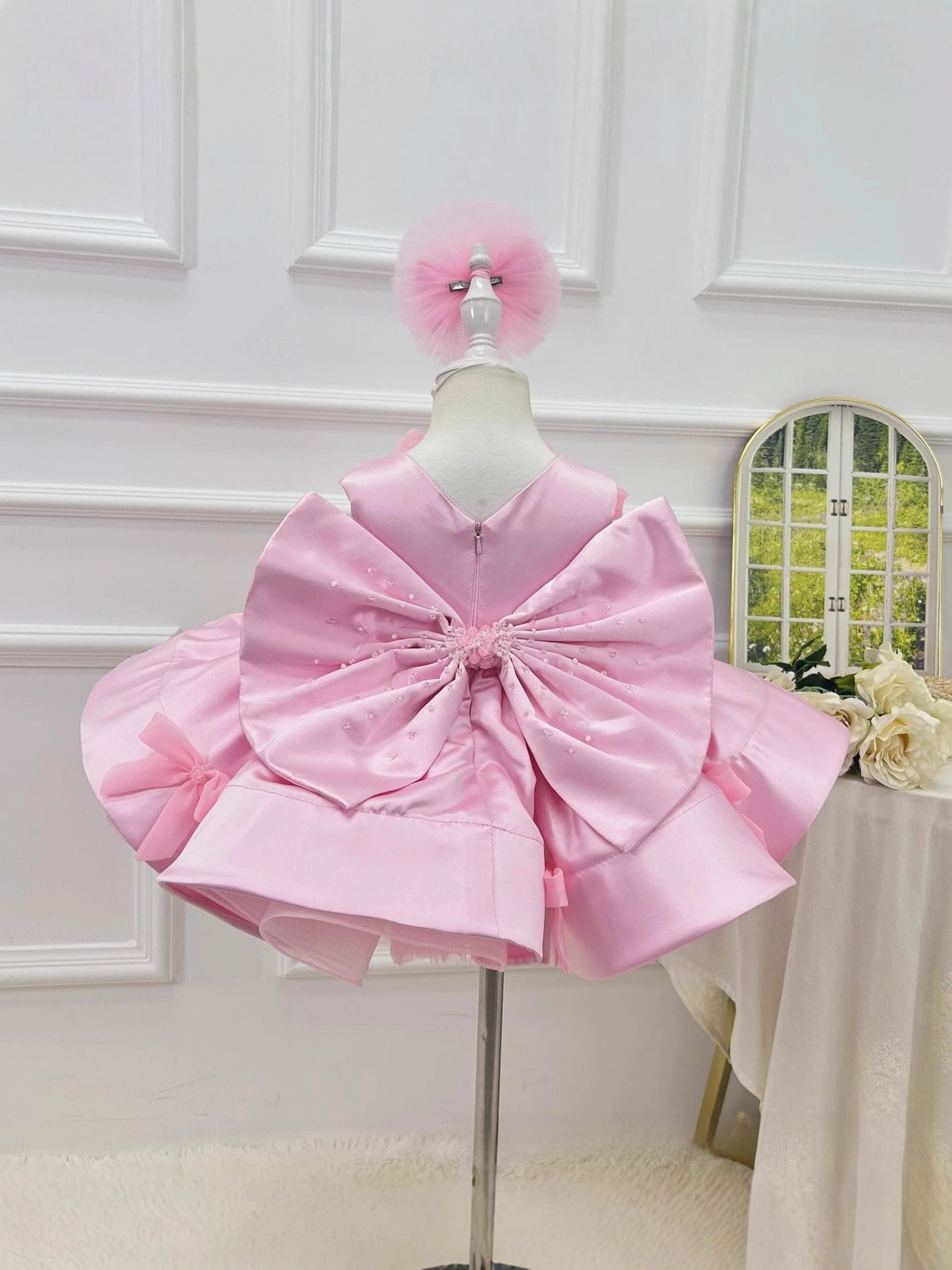Girls pink princess party dress with butterfly bow front view