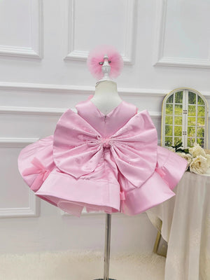 Girls pink princess party dress with butterfly bow front view
