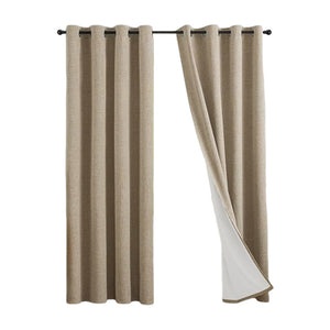 Linen look polyester blackout grommet curtain panel with white thermal backing pleated on a slim black rod over a tall window