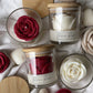 Rose shaped candles in glass jars with bamboo lids, option image for the Pink White Peach and Oolong candle