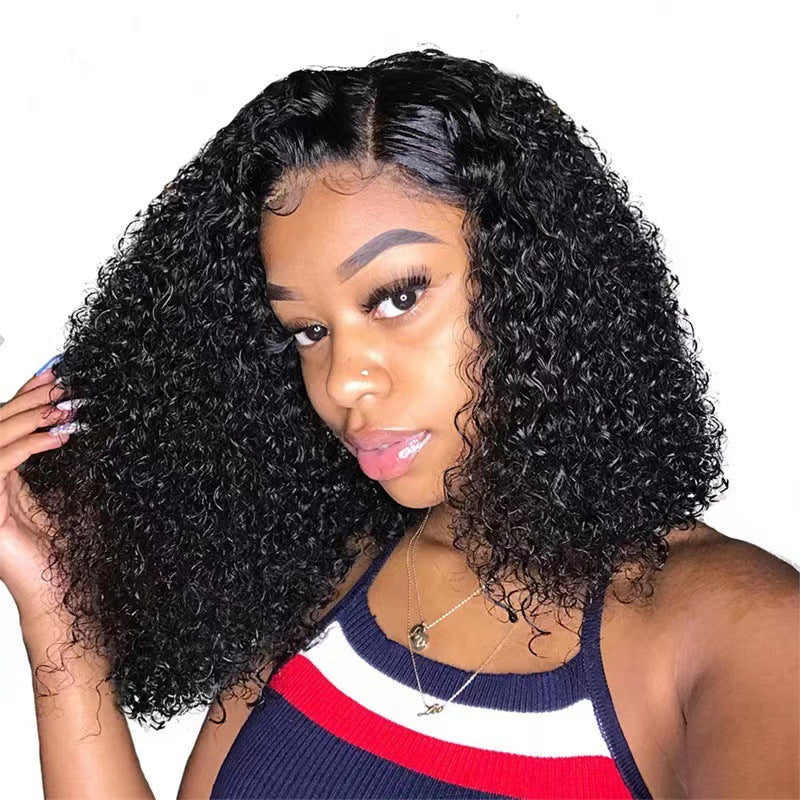 Woman wearing a short curly black synthetic lace front bob wig