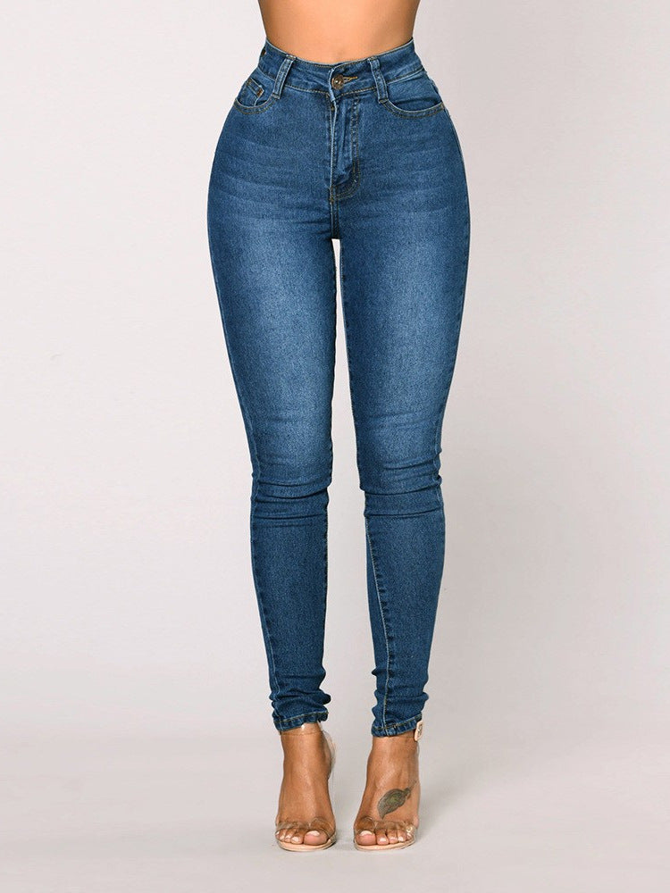 Light blue high rise skinny jeans, front view on model with clear heels