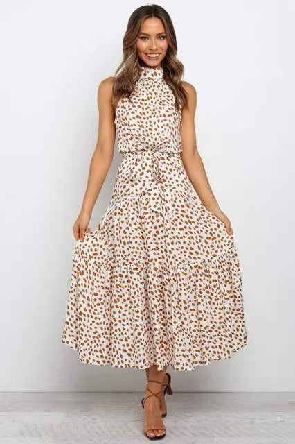 Cream ditsy dot halter neck sleeveless tiered swing maxi dress worn by a model