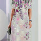 Floral print round neck short sleeve dress shown on a model against a white wall