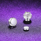 Magnetic stud earring shown in two parts, the stone set front and the plain flat magnet back beside it