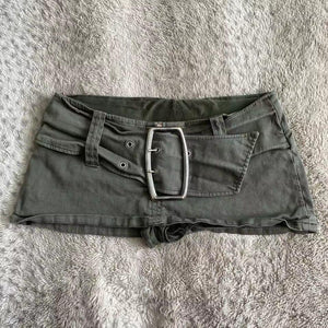 Olive green low rise mini skirt with large silver buckle belt flat lay