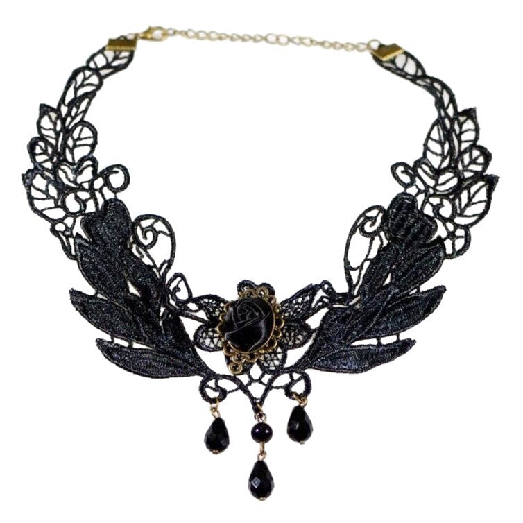 Vintage lace choker necklace displayed on a neck form against a plain backdrop