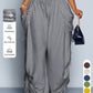 High waist wide leg linen look viscose drawstring trousers, the ruched side ties gathering the outer leg