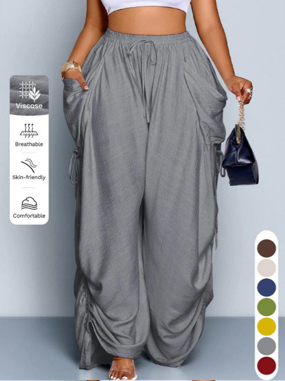 High waist wide leg linen look viscose drawstring trousers, the ruched side ties gathering the outer leg