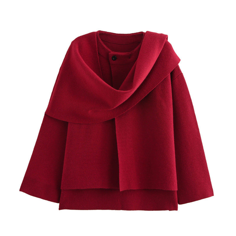 Red knitted coat with a draped scarf collar and flared hem