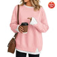 Front view of a off white long sleeve sweatshirt with round neck and layered hem look