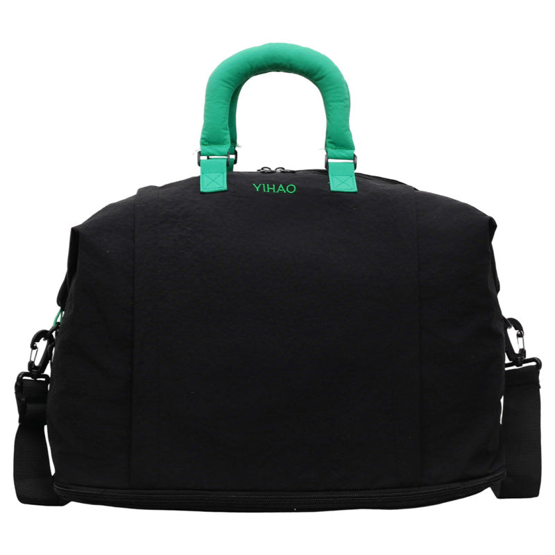 Padded top handles wrapped together on the Oxford travel duffel bag