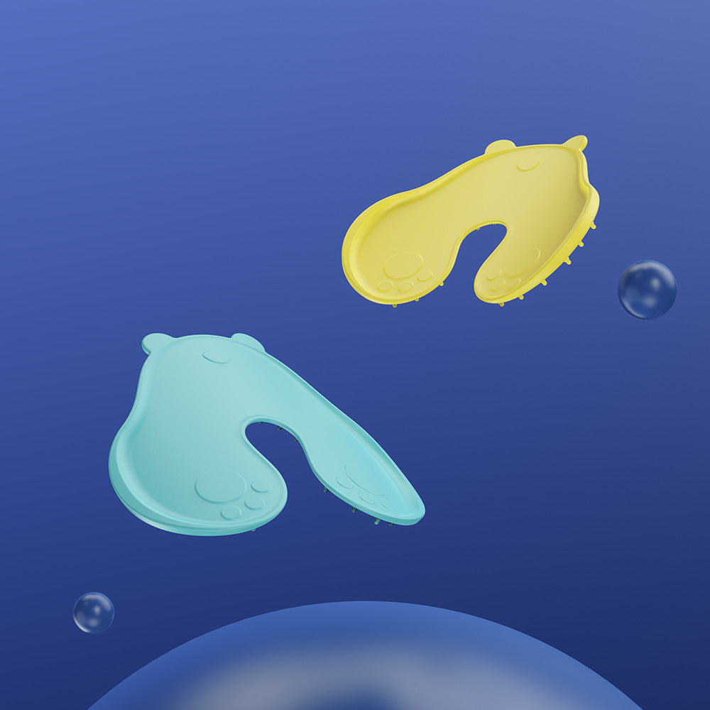 Yellow and mint bear shaped contact point pads floating, each with an open horseshoe notch cutout