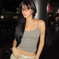 Cropped fitted camisole in a soft solid colour on a plain backdrop