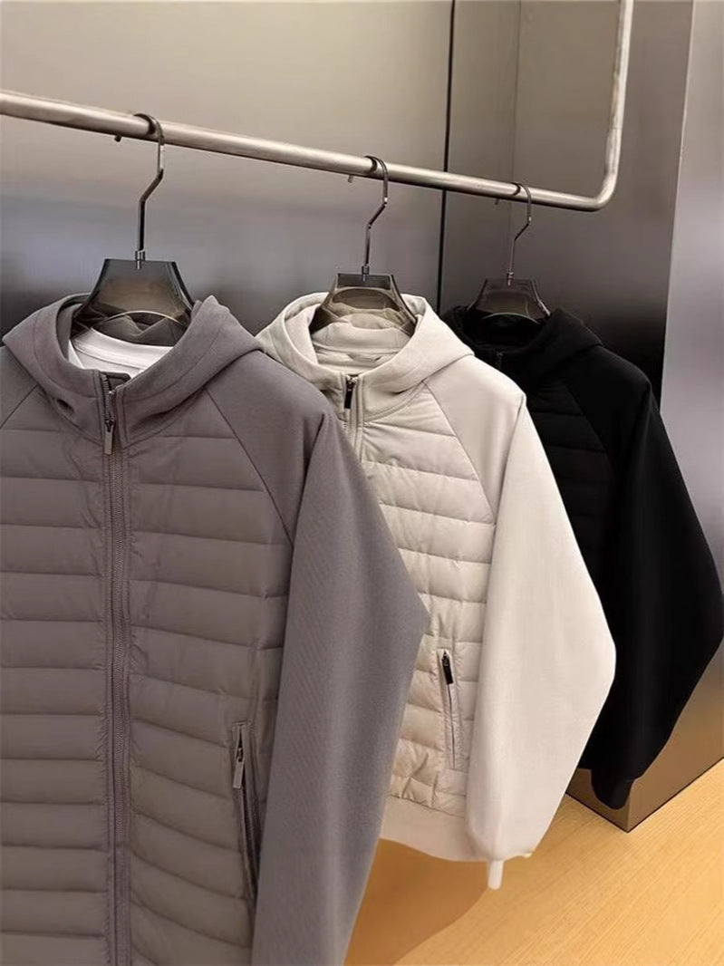 Close view of the quilted padded front panel and centre zip on the hooded jacket