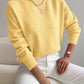 Yellow half-high neck pullover sweater with long sleeves worn with white trousers, size M variant image