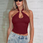 Angled view of the halter crop top highlighting the fitted waist and ring neckline