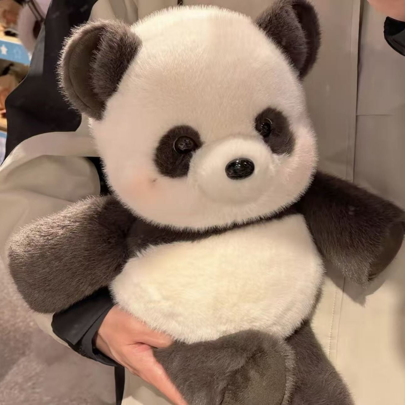 Close up of the soft plush fabric texture and stitched seams on the toy