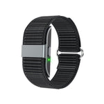 Black woven nylon tracker band with a lit sensor window on the underside