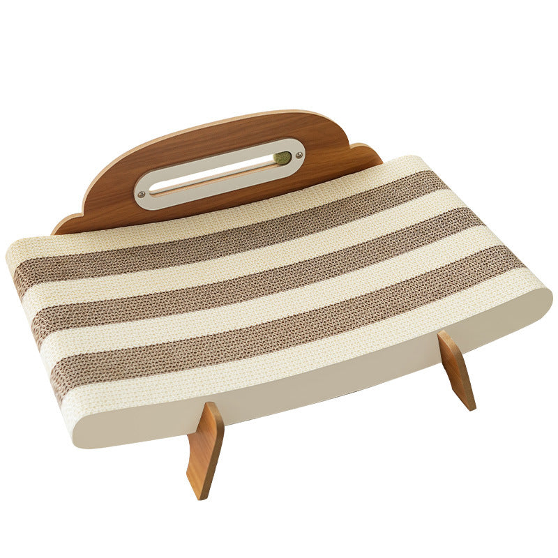 Cat scratcher lounger on a white background showing cream and brown corrugated stripes, headboard and two legs