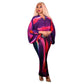Pleated batwing V neck abstract print midi dress on a standing model, back view