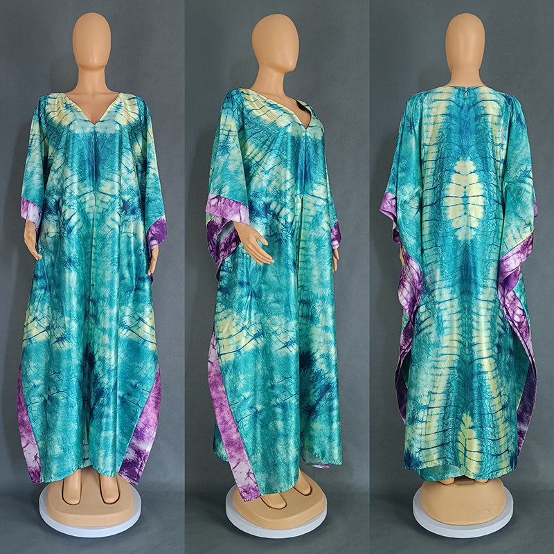 Teal and green tie dye satin caftan gown on a mannequin, front side and back views